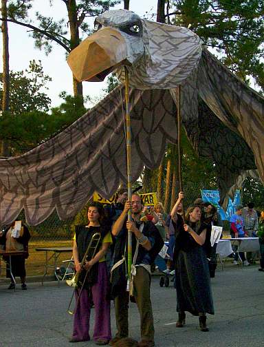 Puppetista at SOA protest with giant eagle puppet
